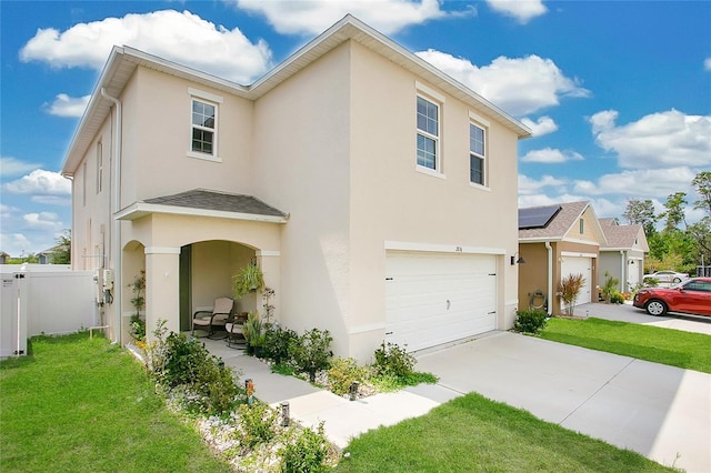 2834 Common Crane Ct, Saint Cloud, FL 34773 - view of front of home with stucco siding, an attached garage, and driveway