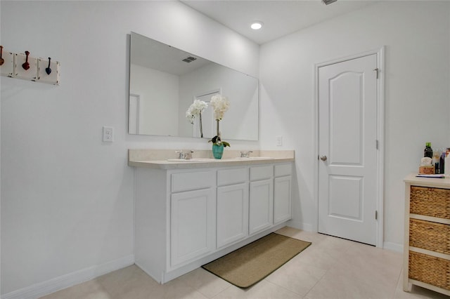 2834 Common Crane Ct, Saint Cloud, FL 34773 - bathroom featuring double vanity, baseboards, and tile patterned floors