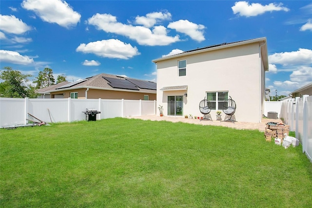 2834 Common Crane Ct, Saint Cloud, FL 34773 - rear view of house with stucco siding and a patio area