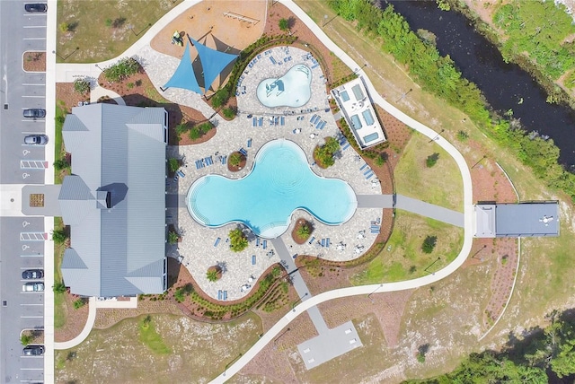 2834 Common Crane Ct, Saint Cloud, FL 34773 - drone / aerial view of a pool area and a nearby body of water