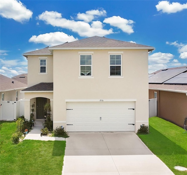 2834 Common Crane Ct, Saint Cloud, FL 34773 - traditional home with stucco siding, roof with shingles, an attached garage, and driveway