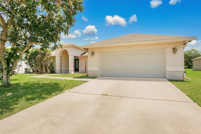 922 Hatteras Ave, Minneola, FL 34715 - single story home featuring concrete driveway, a front yard, stucco siding, and a garage