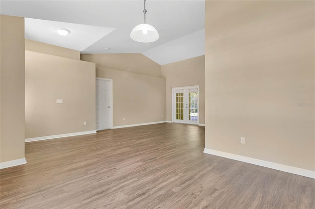922 Hatteras Ave, Minneola, FL 34715 - unfurnished room featuring wood finished floors, high vaulted ceiling, and baseboards