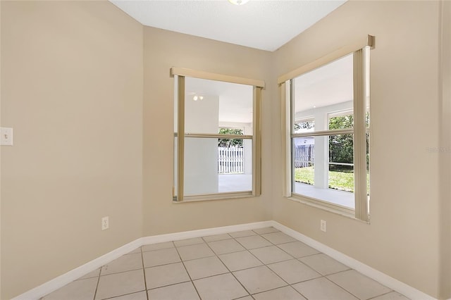 922 Hatteras Ave, Minneola, FL 34715 - empty room featuring baseboards and light tile patterned flooring