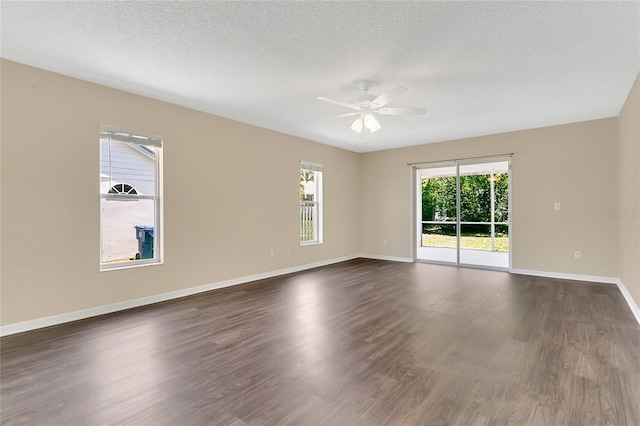 922 Hatteras Ave, Minneola, FL 34715 - empty room featuring ceiling fan, dark wood-style flooring, baseboards, and a textured ceiling