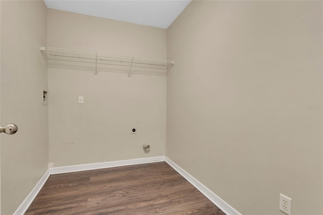 922 Hatteras Ave, Minneola, FL 34715 - laundry room featuring electric dryer hookup, dark wood finished floors, and baseboards