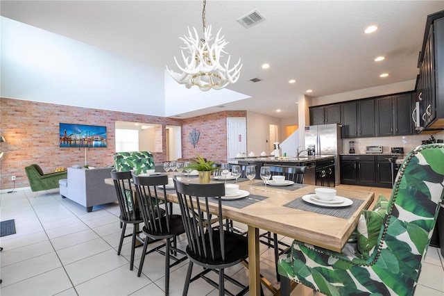 9038 Sunshine Ridge Loop, Kissimmee, FL 34747 - dining space with a chandelier, light tile patterned floors, and recessed lighting