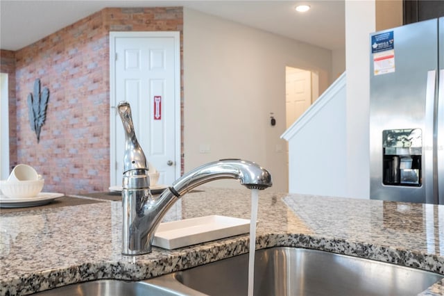 9038 Sunshine Ridge Loop, Kissimmee, FL 34747 - kitchen view of stainless steel fridge with ice dispenser, a sink, and recessed lighting