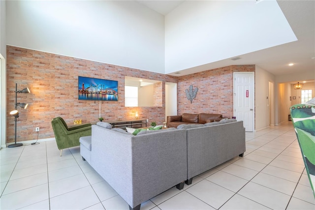 9038 Sunshine Ridge Loop, Kissimmee, FL 34747 - living room with light tile patterned floors and a high ceiling
