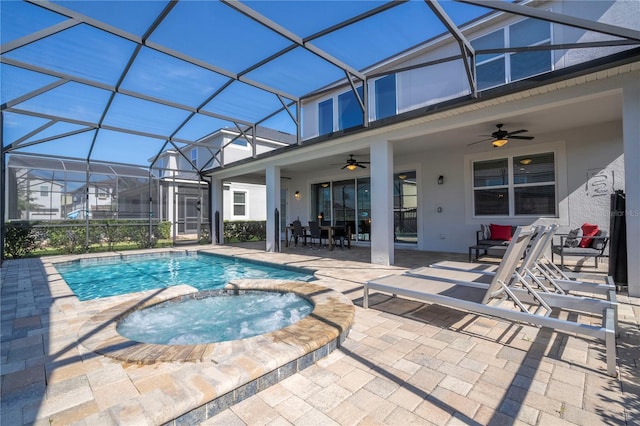 9038 Sunshine Ridge Loop, Kissimmee, FL 34747 - view of swimming pool featuring a ceiling fan, a patio area, a pool with connected hot tub, and a lanai
