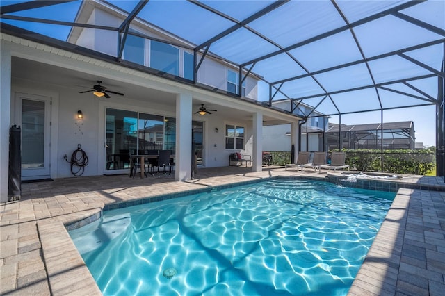 9038 Sunshine Ridge Loop, Kissimmee, FL 34747 - view of swimming pool featuring ceiling fan, a patio area, a pool with connected hot tub, a lanai, and outdoor dining space