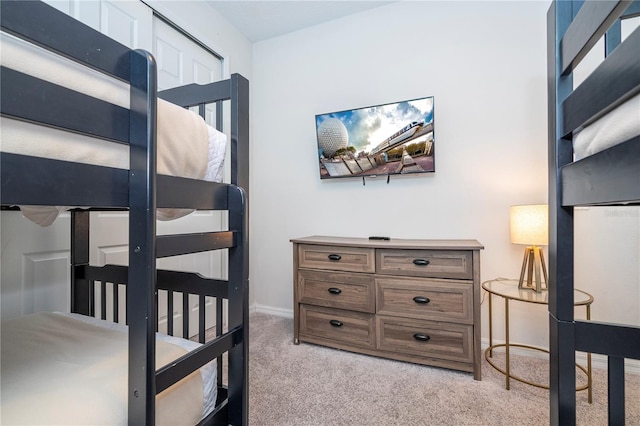 9038 Sunshine Ridge Loop, Kissimmee, FL 34747 - bedroom featuring light colored carpet and baseboards