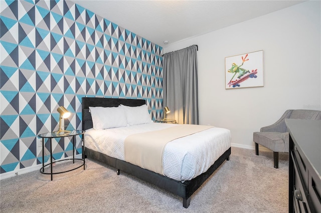 9038 Sunshine Ridge Loop, Kissimmee, FL 34747 - bedroom with wallpapered walls, an accent wall, carpet, and baseboards