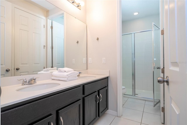 9038 Sunshine Ridge Loop, Kissimmee, FL 34747 - full bathroom with toilet, double vanity, tile patterned flooring, and a stall shower