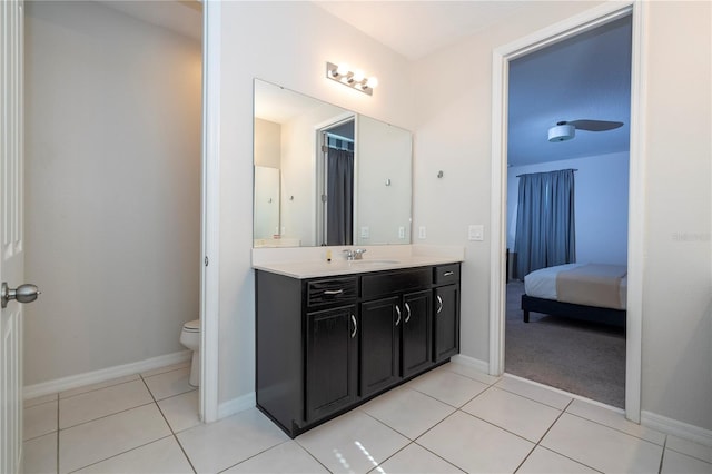 9038 Sunshine Ridge Loop, Kissimmee, FL 34747 - bathroom with connected bathroom, toilet, vanity, and tile patterned floors