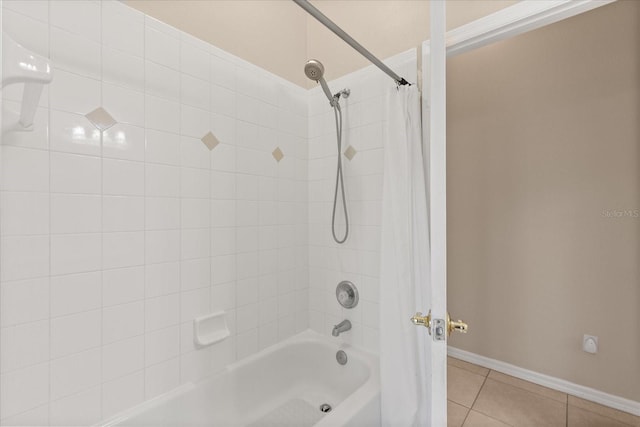 14174 Islamorada Dr, Orlando, FL 32837 - bathroom featuring shower / bath combo, tile patterned floors, and baseboards