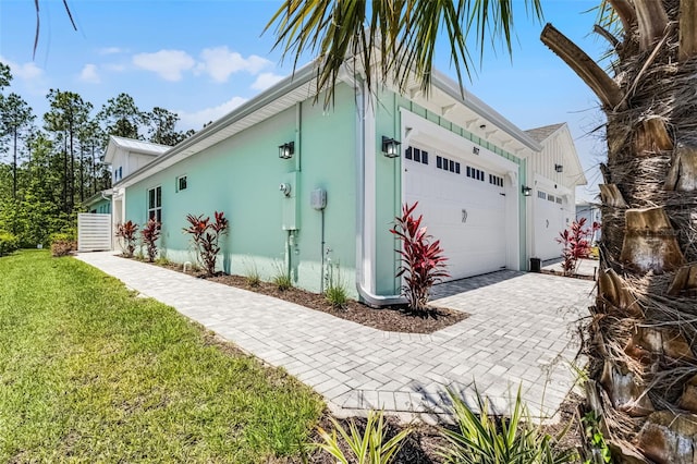 867 Bama Breeze Dr, Daytona Beach, FL 32124 - garage with decorative driveway