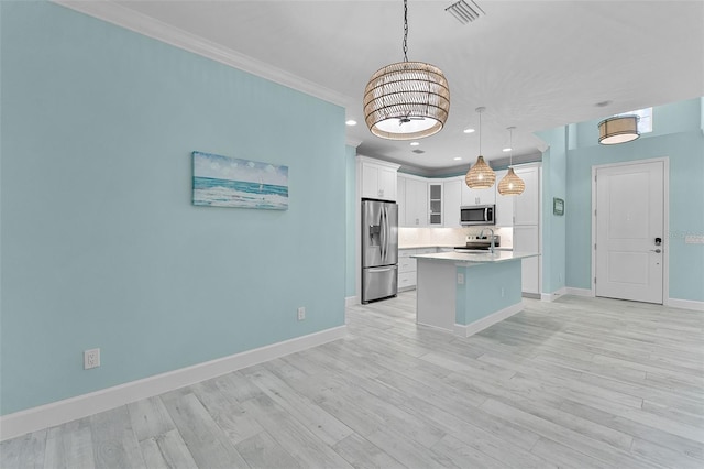 867 Bama Breeze Dr, Daytona Beach, FL 32124 - kitchen with appliances with stainless steel finishes, light countertops, crown molding, white cabinets, and glass insert cabinets