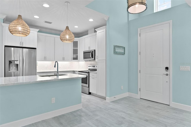 867 Bama Breeze Dr, Daytona Beach, FL 32124 - kitchen with appliances with stainless steel finishes, a sink, glass insert cabinets, white cabinets, and recessed lighting