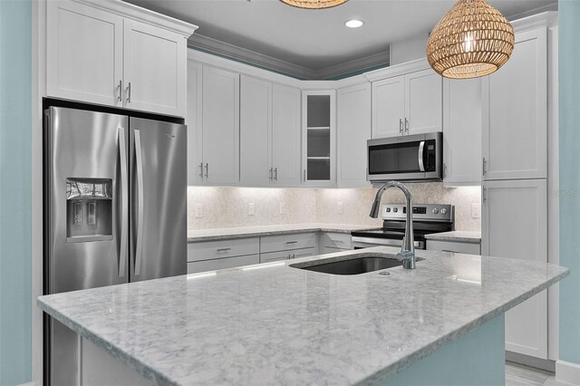 867 Bama Breeze Dr, Daytona Beach, FL 32124 - kitchen with stainless steel appliances, glass insert cabinets, white cabinets, light stone countertops, and recessed lighting