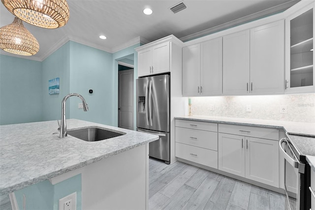 867 Bama Breeze Dr, Daytona Beach, FL 32124 - kitchen featuring stainless steel refrigerator with ice dispenser, a sink, ornamental molding, white cabinets, and recessed lighting
