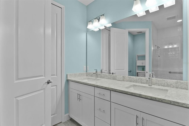867 Bama Breeze Dr, Daytona Beach, FL 32124 - bathroom featuring double vanity and a tile shower