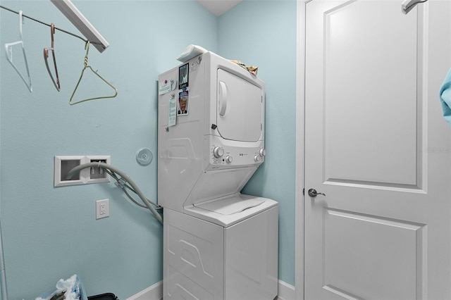 867 Bama Breeze Dr, Daytona Beach, FL 32124 - laundry area with stacked washer / drying machine and baseboards