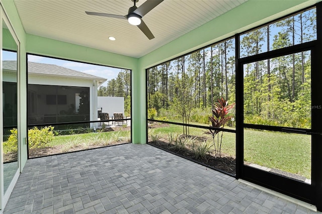 867 Bama Breeze Dr, Daytona Beach, FL 32124 - unfurnished sunroom featuring ceiling fan