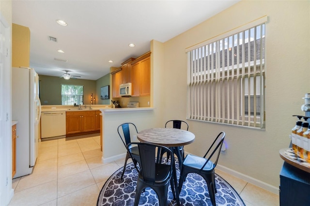 2956 White Cedar Cir, Kissimmee, FL 34741 - dining area featuring light tile patterned floors, ceiling fan, recessed lighting, and baseboards