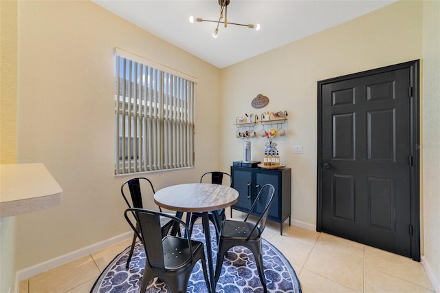 2956 White Cedar Cir, Kissimmee, FL 34741 - tiled dining room featuring a chandelier and baseboards