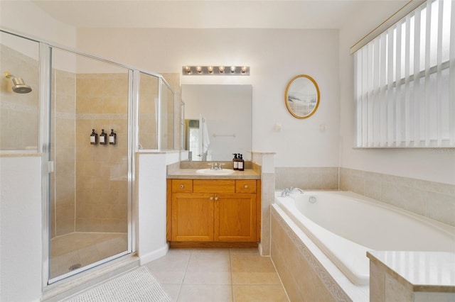 2956 White Cedar Cir, Kissimmee, FL 34741 - bathroom with tile patterned floors, a shower stall, a bath, and vanity