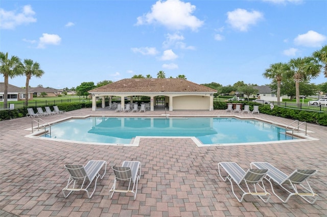 2956 White Cedar Cir, Kissimmee, FL 34741 - community pool featuring fence and a patio