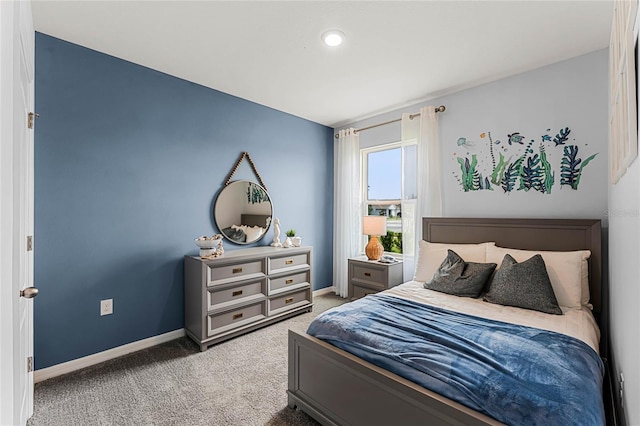 bedroom with carpet flooring and baseboards