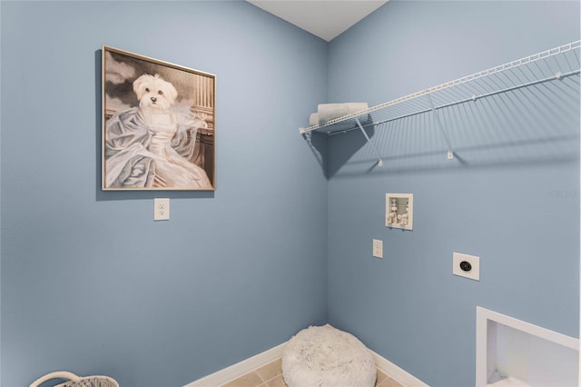 washroom with hookup for an electric dryer, washer hookup, baseboards, and tile patterned flooring