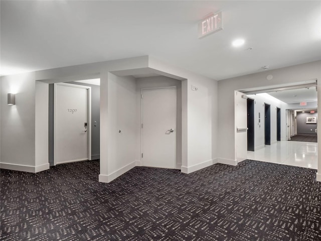 below grade area with carpet and baseboards