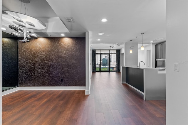 reception featuring recessed lighting and a sink