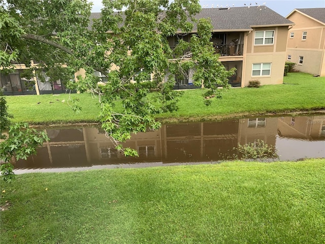 9926 Turf Way Unit 8, Orlando, FL 32837 - view of property's community featuring a lawn and a water view