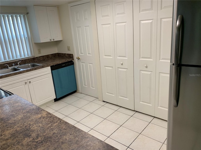 9926 Turf Way Unit 8, Orlando, FL 32837 - kitchen with freestanding refrigerator, dishwasher, a sink, light tile patterned flooring, and dark countertops