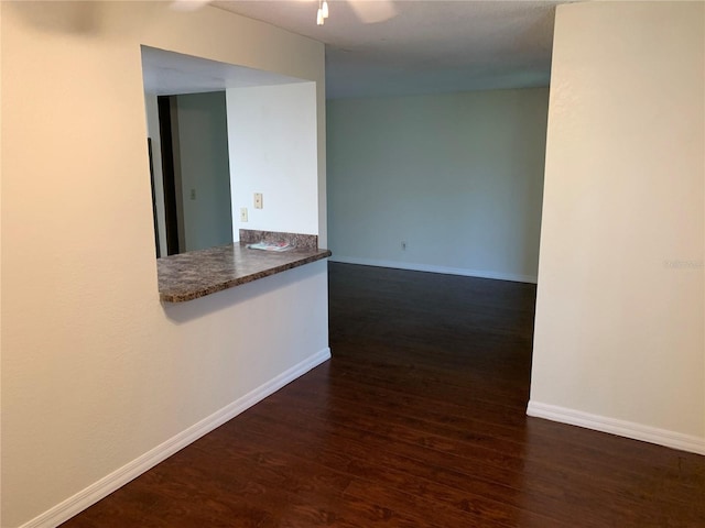 9926 Turf Way Unit 8, Orlando, FL 32837 - spare room featuring dark wood-type flooring, baseboards, and ceiling fan