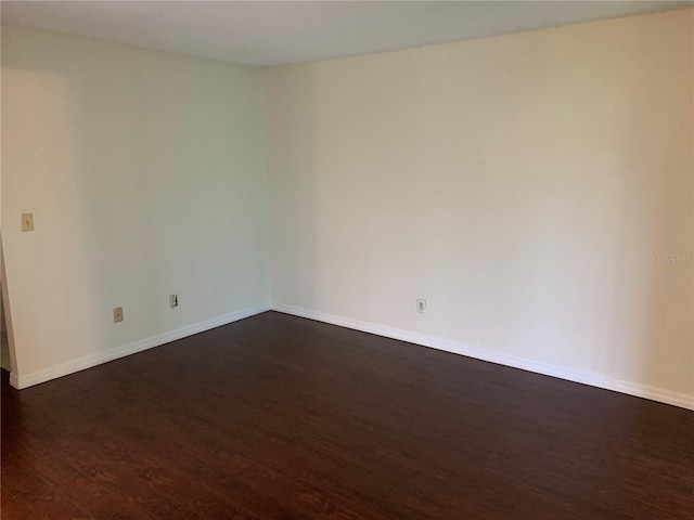 9926 Turf Way Unit 8, Orlando, FL 32837 - empty room with dark wood finished floors and baseboards