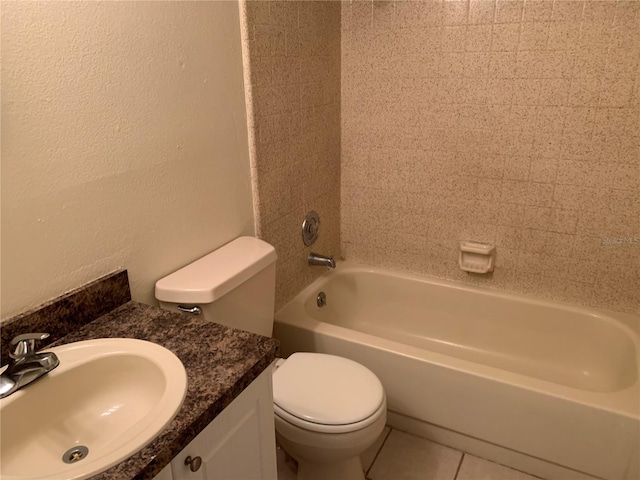 9926 Turf Way Unit 8, Orlando, FL 32837 - bathroom featuring toilet, a textured wall, shower / washtub combination, vanity, and tile patterned flooring
