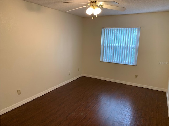 9926 Turf Way Unit 8, Orlando, FL 32837 - unfurnished room with ceiling fan, dark wood-type flooring, and baseboards