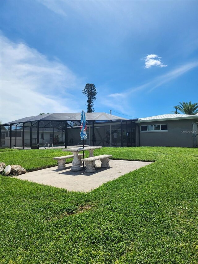 5325 Cocoa Ct, Cape Coral, FL 33904 - view of green lawn with a lanai