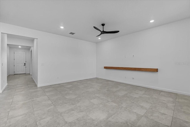 spare room featuring a ceiling fan, recessed lighting, and baseboards