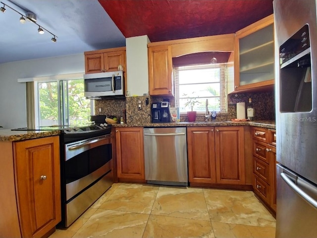1820 James Ave Unit 2F, Miami Beach, FL 33139 - kitchen featuring stainless steel appliances, a sink, tasteful backsplash, and healthy amount of natural light
