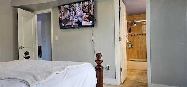 1820 James Ave Unit 2F, Miami Beach, FL 33139 - tiled bedroom featuring ensuite bath and baseboards