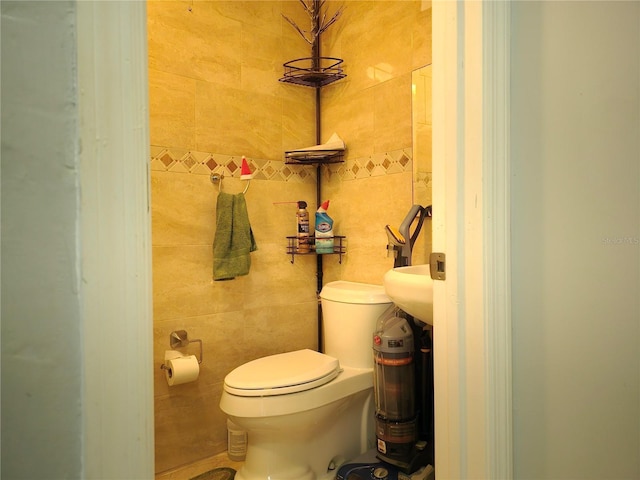 1820 James Ave Unit 2F, Miami Beach, FL 33139 - bathroom featuring toilet and tile walls