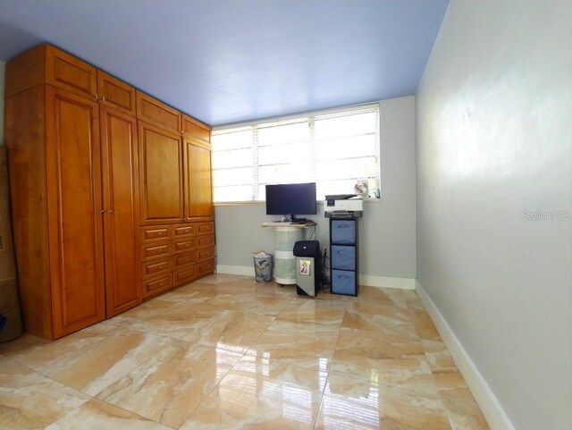 1820 James Ave Unit 2F, Miami Beach, FL 33139 - home office featuring light marble finish floors and baseboards