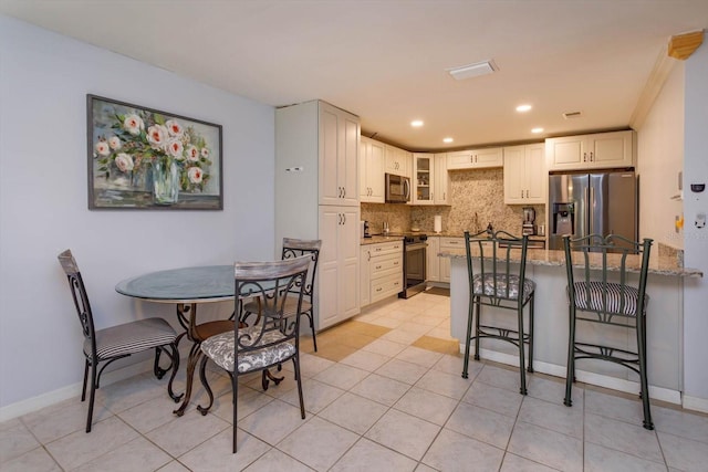 470 Oak Haven Dr Unit 470, Altamonte Springs, FL 32701 - dining space featuring recessed lighting, light tile patterned floors, and baseboards