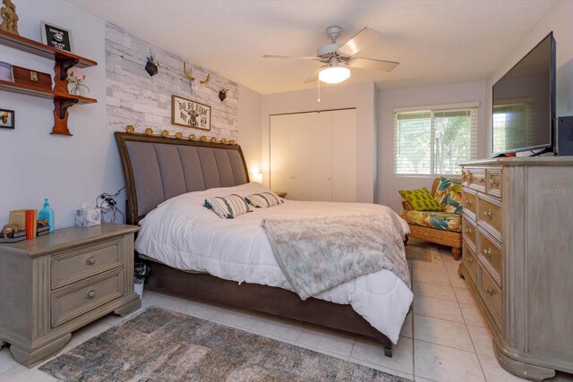 470 Oak Haven Dr Unit 470, Altamonte Springs, FL 32701 - bedroom with light tile patterned floors, a ceiling fan, and a closet